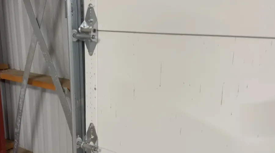 Garage door track and hardware after a completed roller repair