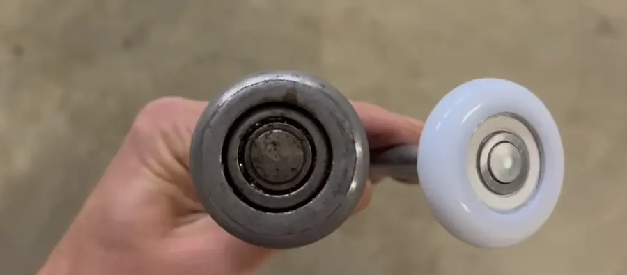 Nylon and steel garage door rollers side by side
